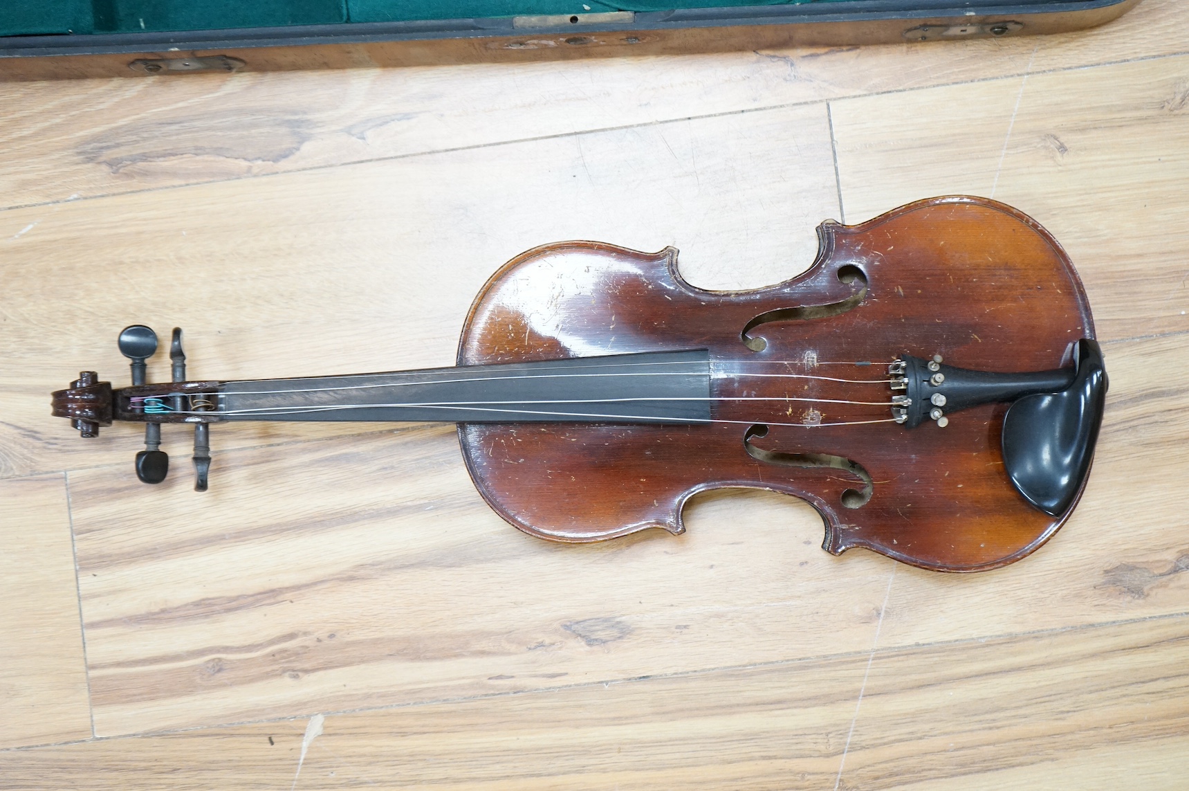 A cased violin, label to interior reads ‘Dulcis et Fortis’, back 36cm. Condition - scratches